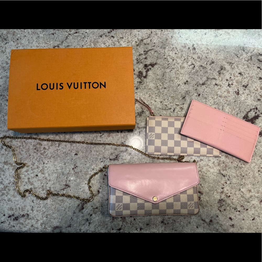 100% authentic Louis Vuitton chain wallet. Pre owned and loved. Signs of wear.